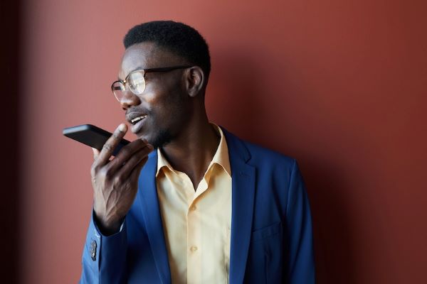 communication student speaking into phone